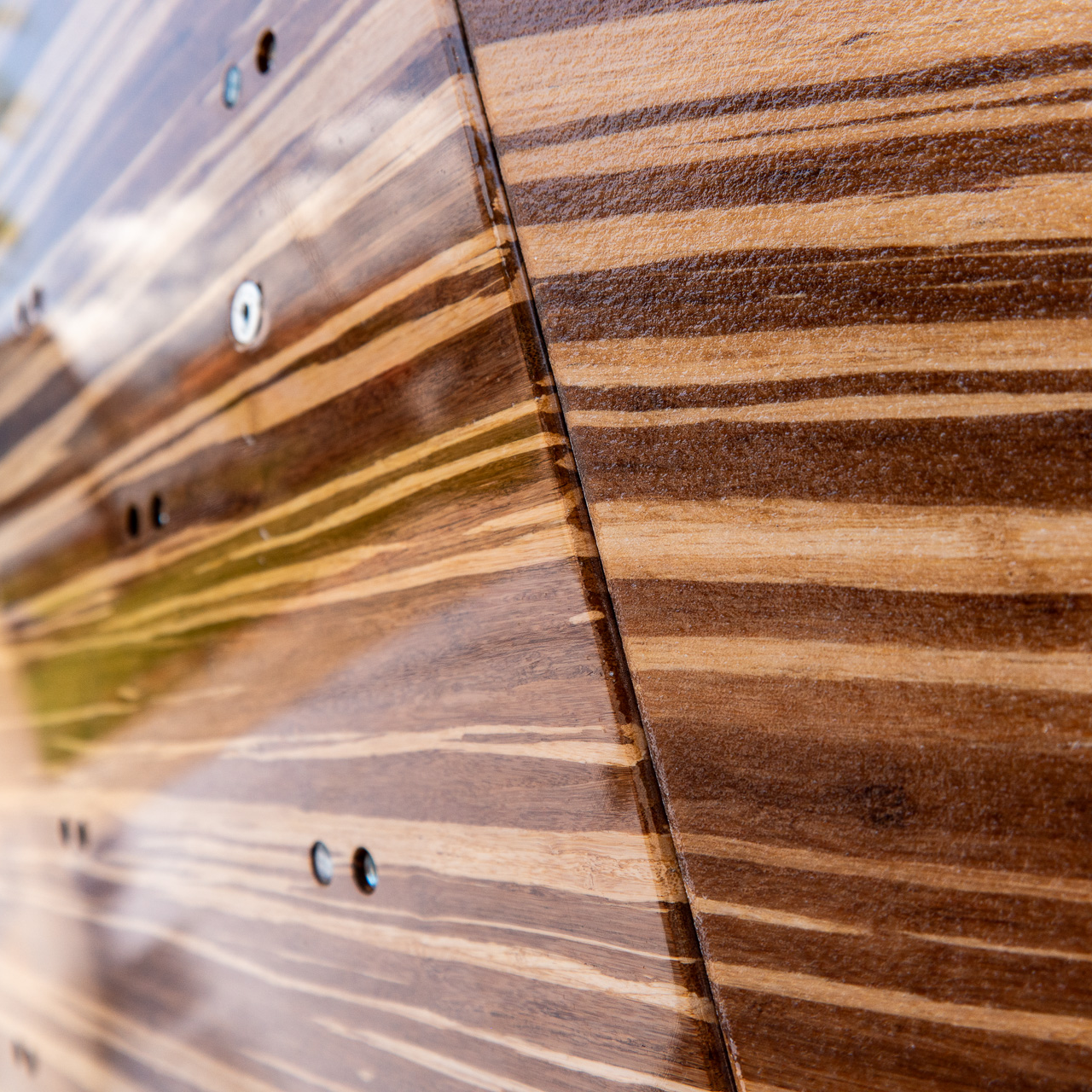 Dual texture natural wood boulder climbing walls with tiger bamboo veneer. Made by Walltopia for the Se&Send boulder comp.